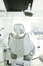 Modern dental clinic with a comfortable chair and equipment for patient care in a bright, clean