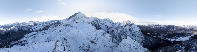 Wonderful winter landscape with Zugspitze, blue sky and snow, mountains and mountain valley, aerial