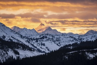 Grossglockner peaks at sunset in winter, spectacular cloudy skies, Hochbrixen, Brixen im Thale,