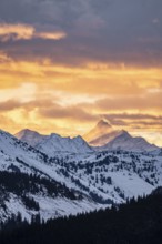 Grossglockner peaks at sunset in winter, spectacular cloudy skies, Hochbrixen, Brixen im Thale,