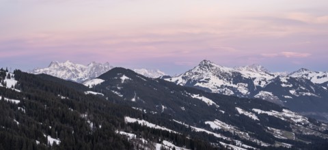 View of Brixental in winter, with peaks of the Kitzbühler Horn and Loferer Steinberge in the back,