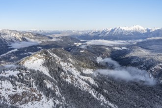 View of snow-covered mountain landscape across the Reintal towards the Estergebirge and