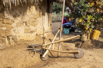 Self-built wooden balance bike, in a Sadaani village, Tanga, Tanzania