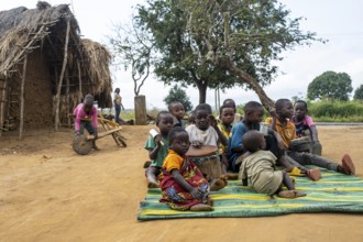 Group of African children playing music with drums in a Sadaani village, Tanga, Tanzania