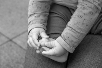 Hands and feet of a baby, half a year old, black and white, Mecklenburg-Vorpommern, Germany