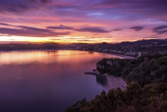 Landscape with sea and sandy beach in New Zealand. View of Lonely Bay and Cooks Beach from