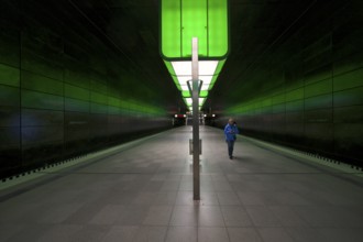 HafenCity University subway station, illuminated in color, green, travelers, platform, stop, train