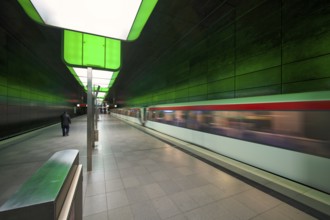 HafenCity University subway station, illuminated in color, green, underground train, movement