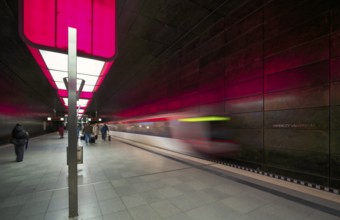 HafenCity University underground station, illuminated in color, magenta, underground train,