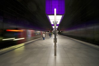HafenCity University underground station, illuminated in color, purple, underground train, movement