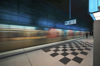 HafenCity University underground station, illuminated in color, blue, underground train, movement