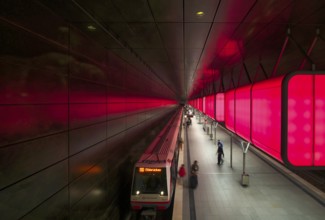 HafenCity University underground station, illuminated in color, red, underground train, U4,