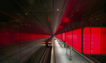 HafenCity University subway station, illuminated in color, red, underground train, movement effect,