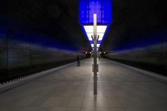 HafenCity University subway station, illuminated in color, blue, travelers, platform, stop, train