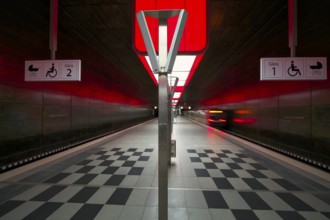 HafenCity University subway station, illuminated in color, red, underground train, movement effect,