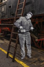Replica of a railroad mechanic in work clothes with oil can, railway museum, Augsburg railway park,