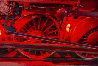 Illuminated wheelwork of a historic locomotive, railway museum, Augsburg railway park,