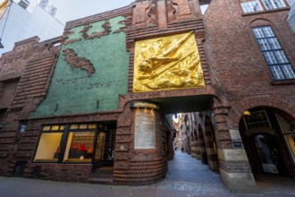Entrance to Böttcherstraße, golden relief, façade relief The Light Bringer by Roland Hötger, Old