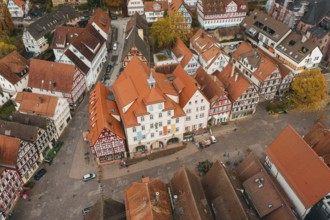 Historic old town with square and surrounding half-timbered houses, lively with pedestrians, Calw,