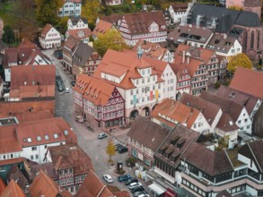 View of traditional city center with half-timbered houses and town hall in autumn atmosphere, Calw,