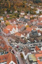 Picturesque city view in autumn with half-timbered houses and church in the middle, Calw, Black