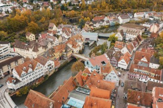 Historic old town with half-timbered houses and river views, surrounded by autumn trees, Calw,
