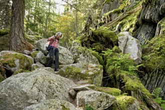 Female hiker on mountain tour in rocky terrain, Mont-Blanc, Chamonix-Mont-Blanc, Haute-Savoie,