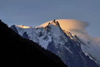 Aiguille du Midi with sun-lit cloud above the summit, Mont-Blanc, Chamonix-Mont-Blanc,
