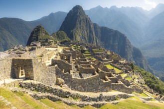 Ancient Inca ruins in Machu Picchu surrounded by majestic mountains in the Andes, Peru