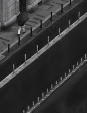 Man with umbrella walking on a street, from above, monochrome, street scene, Belgrade, Serbia