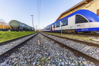 Modern Bavarian Regional Railway train, BRB, boiler wagons, parked in front of Augsburg railway