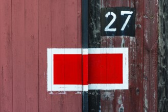 Protection signal with red and white paint at entrance gate no. 27 to the old engine shed, Augsburg