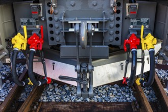 Yellow and red levers for main air lines on a modern railway locomotive, Augsburg railway park,