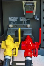 Yellow and red lever for main air lines on a modern railway locomotive, Augsburg railway park,