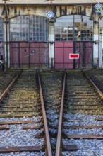 The entrance gates 26 and 27 and railroad tracks of the old engine shed, Augsburg railway park,