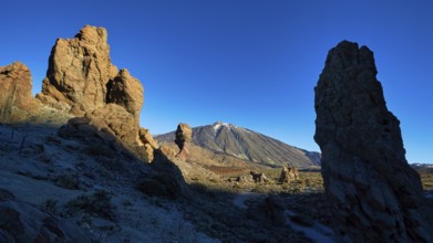 Dramatic rock formations in volcanic landscape with long shadows, UNESCO World Heritage Site, Teide