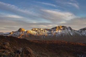 Mountains in the light of sunrise with soft clouds in the sky, UNESCO World Heritage Site, Teide