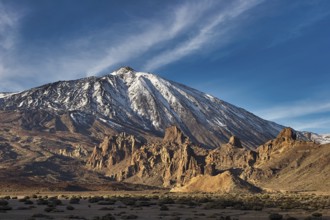 Snow-capped Teide, large mountain with illuminated shadows and deep blue sky, UNESCO World Heritage