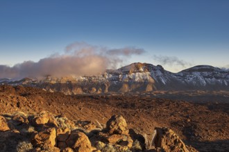 Wide mountain landscape with clouds and rugged rocks under a clear sky, UNESCO World Heritage Site,