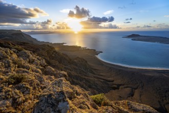 View of steep cliffs on sea and coast, Mirador del Porrito viewpoint at sunset, Lanzarote, Canary
