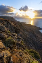 View of steep cliffs on sea and coast, Mirador del Porrito viewpoint at sunset, Lanzarote, Canary