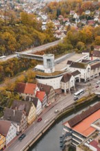 Aerial view of a city with colorful autumn leaves, river and central tower building, Hermann