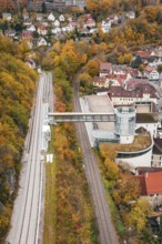 View of railroad, tower and municipal buildings surrounded by autumn colors, Hermann Hessebahn, ZOB
