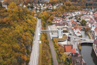 Panoramic view of railway tracks, city and river, with central tower in autumn, Hermann Hessebahn,