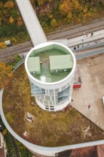Detailed view of a tower with a green roof and walkers, Hermann Hessebahn, ZOB Calw, Germany