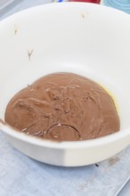 A white bowl of melted chocolate in the kitchen, Christmas baking, Haselstaller Hof, Wildberg,