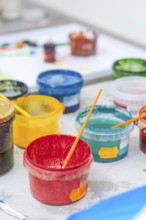 Colourful painting supplies in colorful plastic containers on a table, Christmas baking,
