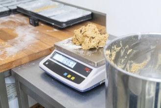 Dough on a digital scale in a kitchen, preparation for baking, Christmas baking, Haselstaller Hof,