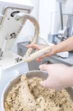 A hand grabs a mixing machine filled with dough, Christmas baking, Haselstaller Hof, Wildberg,