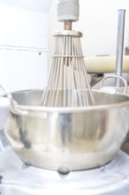 A large industrial metal mixing machine in a production kitchen, Weihnachtsbacken, Haselstaller